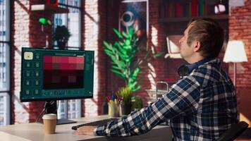 Man requesting help from text to image GPT software in modern home office, turning prompts into photos. Person in brick wall home office using PC get help for tasks from text to image AI, camera A video