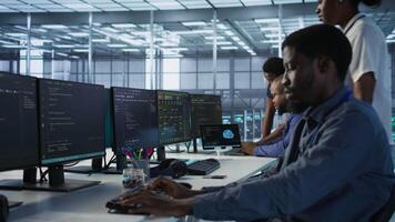 Engineer arriving in data center, saluting colleagues, starting maintaining company network infrastructure. Woman entering server hub, starting job shift, ensuring optimal system performance, camera A video