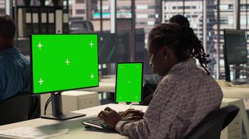 Corporate executive worker focused on strategic planning next to green screen, accomplishing business objectives. Female manager engaged in budget analysis and performance metrics. Camera A. video