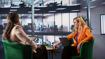 Woman CEO dealing with headache from burnout in a modern office space, discussing business growth and strategic planning. Leader emphasizing corporate feminism and gender equality. Camera B. video