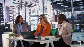 Multicultural group of women in a high powered office meeting, promoting gender equality and female authority in a work environment. Leaders in a men dominated business industry. Camera B. video