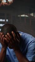 Vertical Nurse experiences emotional stress sitting in counseling session, professional deals with mental health issues because of the risks of his occupation. Trauma from patient loss. Camera A. video