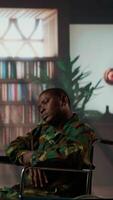 Vertical Military war veteran is in a vulnerable state opening up about combat horror scenes, crying and feeling frustrated after losing troopers. Serviceman discussing about traumatic experiences. Camera B. video