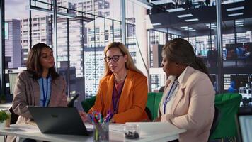 Diverse women executives in a modern office discussing business growth, career development and gender equality. Powerful leaders in action uniting forces to expand the enterprise. Camera B. video
