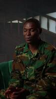 Vertical Black distraught war veteran crying due to shell shock and combat flashbacks, cure his anxiety after traumatic experiences. Army soldier dealing with a mental disorder during therapy. Camera A. video