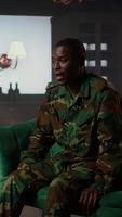 Vertical Military war veteran is in a vulnerable state opening up about combat horror scenes, crying and feeling frustrated after losing troopers. Serviceman discussing about traumatic experiences. Camera A. video