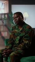 Vertical African american soldier remembering war flashbacks and dealing with a serious case of shell shock syndrome, traumatic memories. Armed forces veteran feels guilty with PTSD. Camera A. video