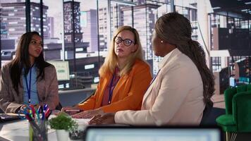 Multiethnic staff helping their director to overcome a business failure, working together to fix this problem. Businesswomen discussing with the CEO for consolation, organizational risks. Camera B. video
