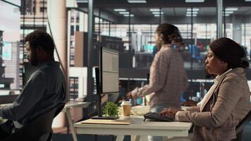 Skilled female investor working on financial forecasts at her workstation, using monthly infographics data to manage business tasks for enterprise development. Company goals. Camera A. video