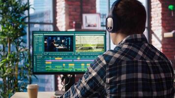 editor analyzing film montage, editing color grading and lighting in creative home office, zoom in. Post production studio employee working with raw footage to improve quality, camera A close up video