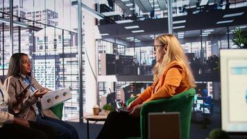General director reviewing data analytics with her team for successful development plan, working hard to expand the business globally. CEO showing great leadership skills, briefing meeting. Camera B. video