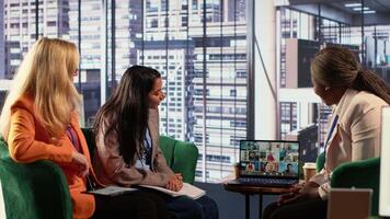 Multicultural team of women leaders hold online conference call, showcasing collaboration and career growth in professional remote setting. Entrepreneurs discuss with investors group. Camera A. video