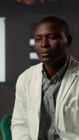 Vertical Doctor in white coat opening up about his medical career struggles, suffering from anxiety and mental health issues. Therapist listens with empathy, discussing grief and emotional support. Camera B. video