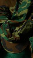 Vertical Armed forces trooper deals with depersonalization syndrome due to combat PTSD, feeling distressed and dissociative during therapy session. Black soldier with shell shock and trauma. Camera B. video