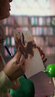 Vertical Military veteran studies Rorschach inkblot in therapy session with counselor, addressing PTSD and trauma recovery problems. Woman shows psychological support for mental health care. Camera A. video