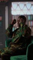 Vertical Black combat veteran faces grief and trauma crying at therapy session, addressing PTSD and talking about combat scenes. Sad shocked soldier shares war flashbacks with counselor. Camera A. video