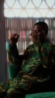 Vertical Black combat veteran faces grief and trauma crying at therapy session, addressing PTSD and talking about combat scenes. Sad shocked soldier shares war flashbacks with counselor. Camera B. video