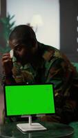 Vertical Military officer discuss with a counselor next to copy space display, suffering from shell shock after horror war flashbacks. Therapist offers help and support to african american trooper. Camera A. video