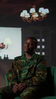 Vertical Armed forces officer discussing about his war memories during counseling session, joining a rehabilitation program for soldiers. Trooper opening up about PTSD and trauma. Camera B. video