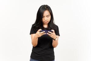 Playing Mobile Game on Smartphone of Beautiful Asian Woman Isolated On White Background photo