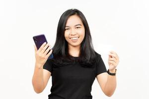 Holding Smartphone and Blank Bank Card or Credit Card of Beautiful Asian Woman Isolated On White photo