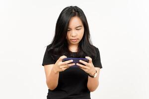 Playing Mobile Game on Smartphone of Beautiful Asian Woman Isolated On White Background photo