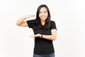Measuring and Showing Big Sign Product of Beautiful Asian Woman Isolated On White Background photo