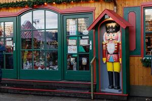 Berlin, Germany, 2019 - Large nutcracker standing in front of a christmas shop photo