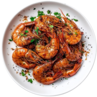 A plate of cooked shrimp with herbs on top png