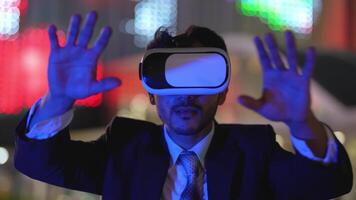 Businessman in a formal suit experiencing virtual reality with a VR headset. Modern technology meets professional innovation, exploring immersive solutions for business and communication. video