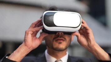 Businessman in a formal suit experiencing virtual reality with a VR headset. Modern technology meets professional innovation, exploring immersive solutions for business and communication. video