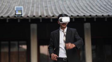 Businessman in a formal suit experiencing virtual reality with a VR headset. Modern technology meets professional innovation, exploring immersive solutions for business and communication. video