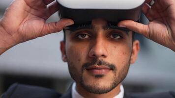 Businessman in a formal suit experiencing virtual reality with a VR headset. Modern technology meets professional innovation, exploring immersive solutions for business and communication. video