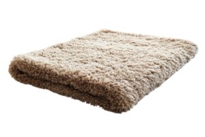 Soft beige blanket is neatly folded on a surface in a cozy indoor setting png