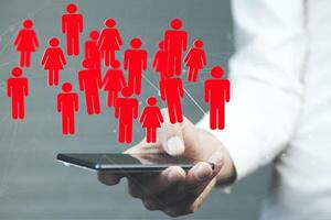 man hand phone and team work in the screen photo