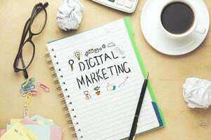 digital marketing text on notepad photo