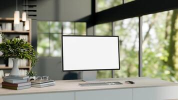 A computer desk in a modern office or home office featuring a computer and decor on a wooden table. photo