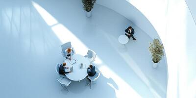 People sitting at a table with papers in front of them photo