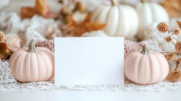 Autumn seasonal display mockup with white card surrounded by pink, white pumpkins, vintage lace, scattered dried botanical elements photo