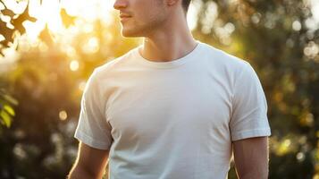 Close up of a white t shirt on a man standing in nature with hands in pockets, perfect mockup for your design photo