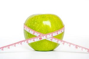 measure the apple with ruler, The concept of healthy diet photo