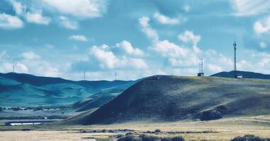 The wind turbines are on the ridge of the mountain photo
