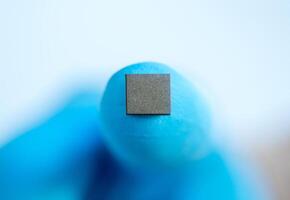 hand holding microchip, future of the Artificial Intelligence photo