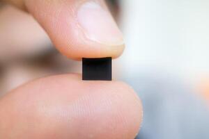 hand holding microchip, future of the Artificial Intelligence photo
