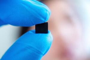 hand holding microchip, future of the Artificial Intelligence photo