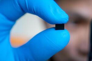 hand holding microchip, future of the Artificial Intelligence photo