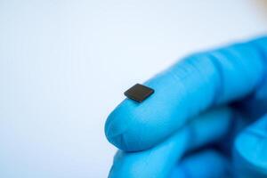 hand holding microchip, future of the Artificial Intelligence photo