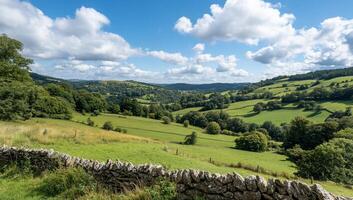 Scenic view of rolling hills and lush greenery under a blue sky. photo