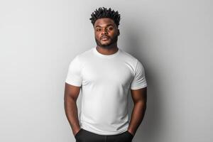 Confident young man poses in casual outfit against plain background photo