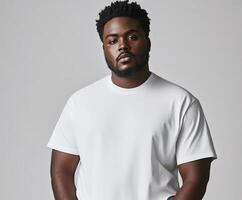 Man wearing a white t-shirt poses confidently against a neutral background photo